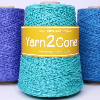 Cone of turquoise linen cotton yarn with a yellow Yarn2Cone label, displayed alongside other vibrant linen cotton yarns in blue and purple shades.