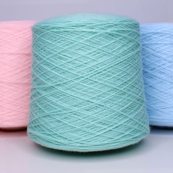 Cones of 4 ply acrylic yarn in pastel mint, pink, and blue shades.